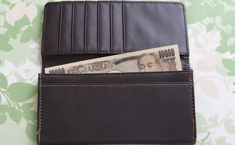 Wallet containing a yen banknote