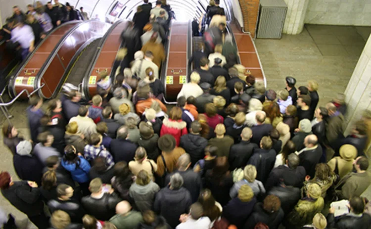 Photo of a crowded escalator in the London Underground