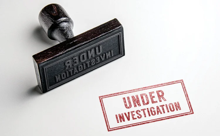 shu-427898212-rubber-stamp-under-investigation